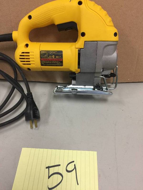 lot 59 image: DEWALT 5.5 Amp Jig Saw in like new working conditions