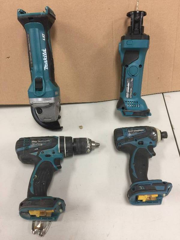 lot 71 image: Makita 4 pc tool  used in working conditions one  4-12 in. Cordless Cut-OffAngle Grinder, 1, 18-Volt LXT Lithium-Ion Cordless Cut-Out Tool , 1, 12 in. Cordless Hammer Driver-Drill Kit, 1, 18-Volt LXT Lithium-Ion 14 in. Cordless Impact Driver Kit