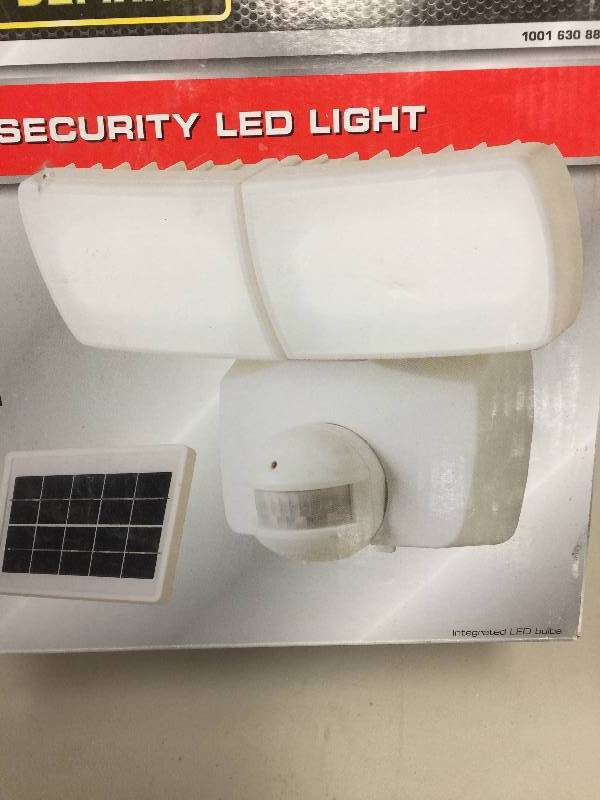 lot 84 image: Defiant 180 Degree White Solar Motion Activated LED Twin Head Flood Light open box never used