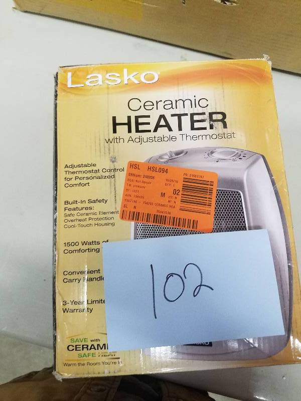 lot 102 image: Lasko 9.2 in. 1500-Watt Electric Portable Ceramic Compact Heater Model#  754200  open box never used