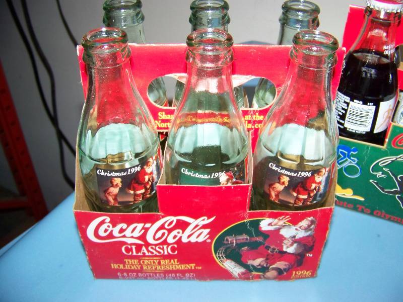 lot 105 image: Vintage  Collectible, Coca-Cola  Coke  Coca Cola, 6 Packs with 8 oz Bottles - Christmas and Olympics themed