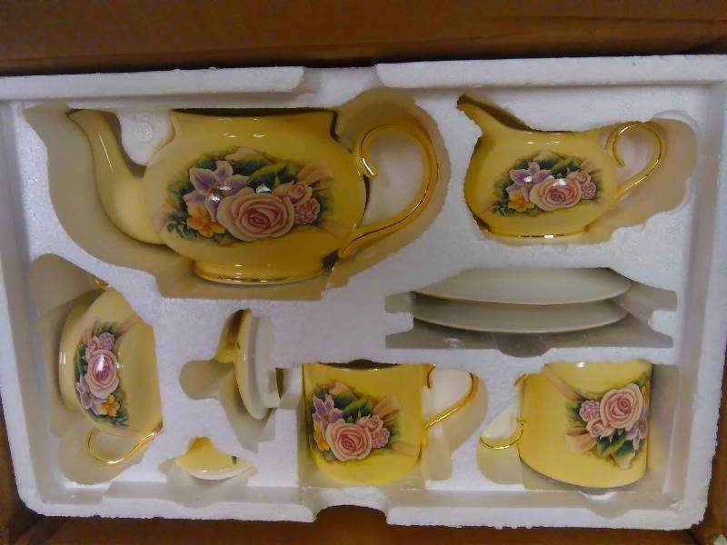 lot 54 image: Vintage Hour of Power Yellow Floral and Gold Trimmed Bone China 9 Piece Tea Set