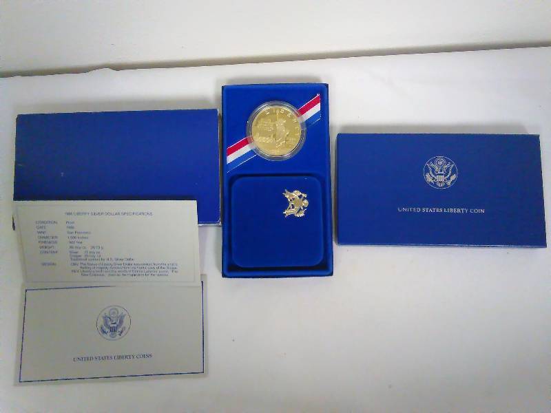 lot 60 image: Vintage 1986 Ellis Island United States Liberty Silver Dollar
