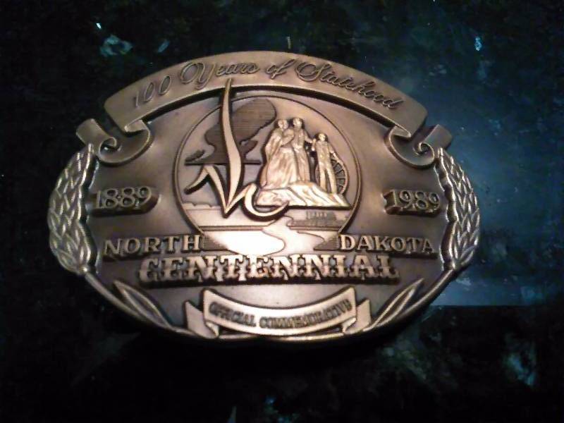 lot 204 image: Vintage Belt Buckle, ND 100 Year Centennial 1989