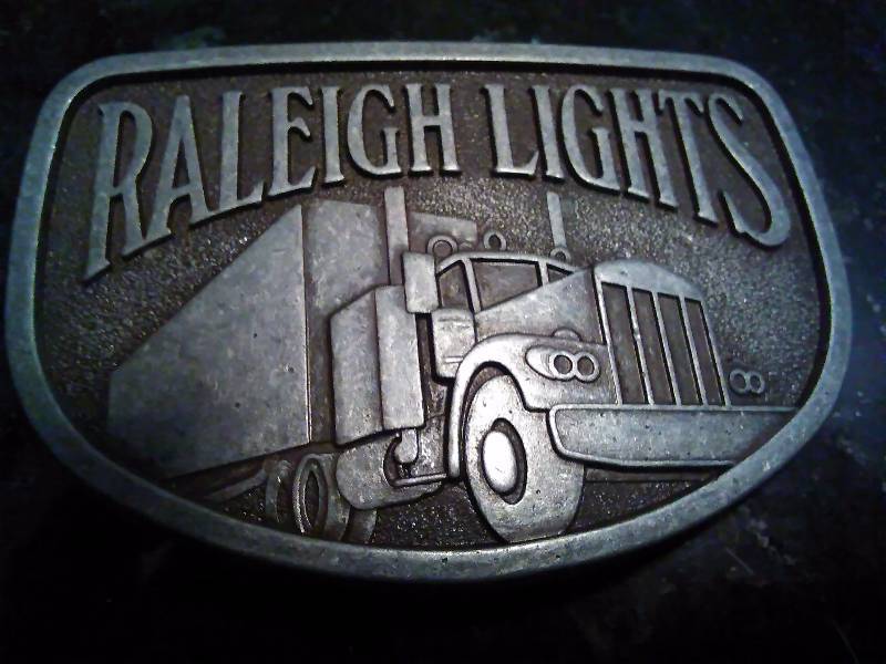 lot 235 image: Vintage Belt Buckle, Raleigh Lights Semi Truck, Tractor Trailer
