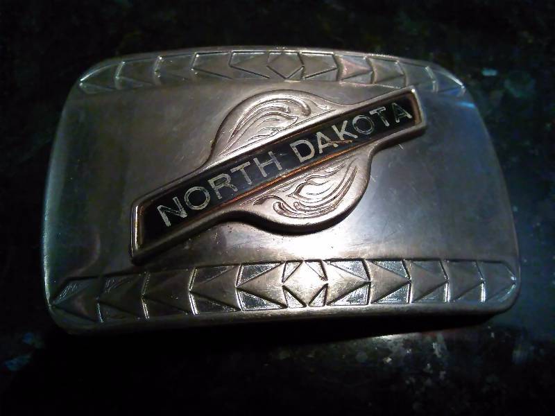 lot 244 image: Vintage Belt Buckle, North Dakota Silver Colored