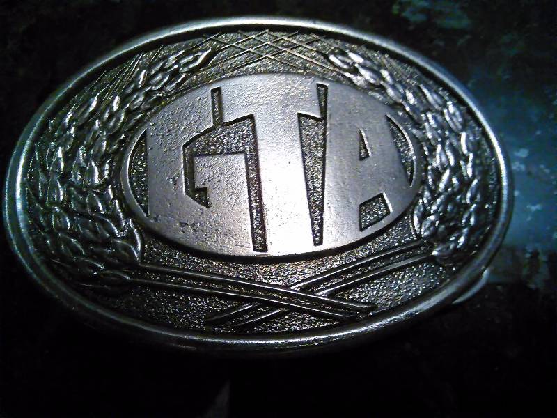 lot 260 image: Vintage Belt Buckle, GTA Feed & Elevator, 1980 First Edition
