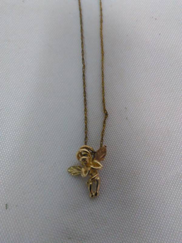 lot 148 image: Black Hills Gold, guardian angel is dainty, 10k gold with chain