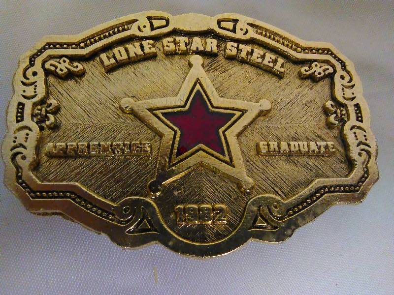 lot 157 image: Vintage Belt Buckle, Lone Star Steel, 1982, Gold colored with Red Star