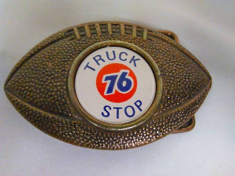 lot 167 image: Vintage Belt Buckle, Football Shaped, Union 76 Truck Stop, C & D-Hit. Inc. USA