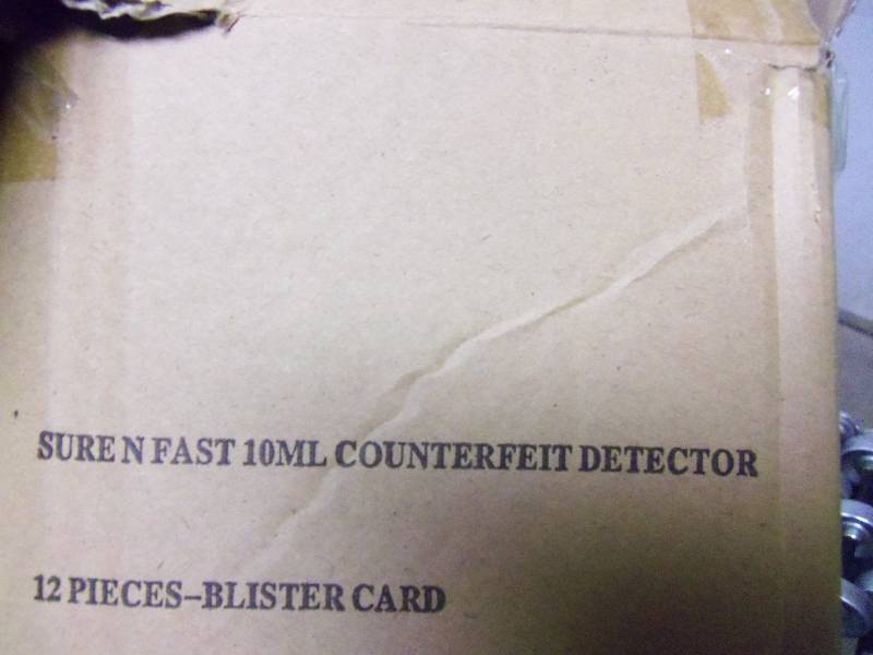 Box of Counterfeit Detector Pans