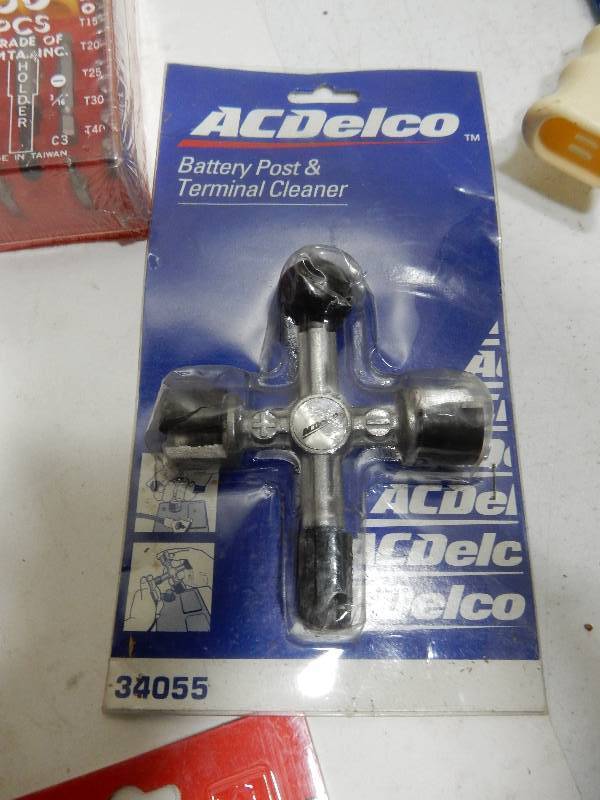 lot 76 image: Large lot of items as pictured.. Box of Box cutters (approx 30), Allenwrenches Tie Downs Vise Grips, AC Delco lug wrench and more