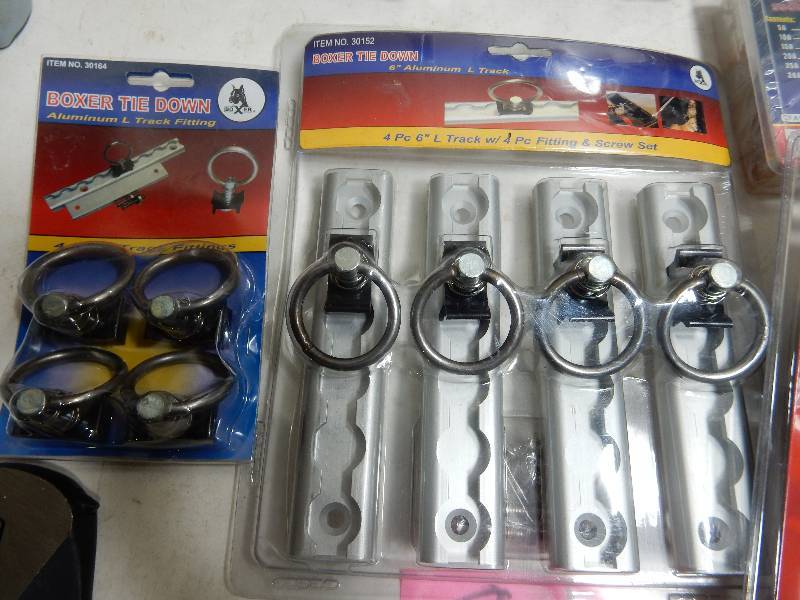lot 81 image: Boxer Tie downs Car Fuse kit, Claw hammer LED Flashlight crescent wrench