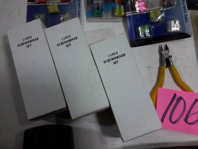 lot 106 image: Mallet, 2 wire brushes, misc wrenchestools, car fuses  3, 11piece screw driver sets