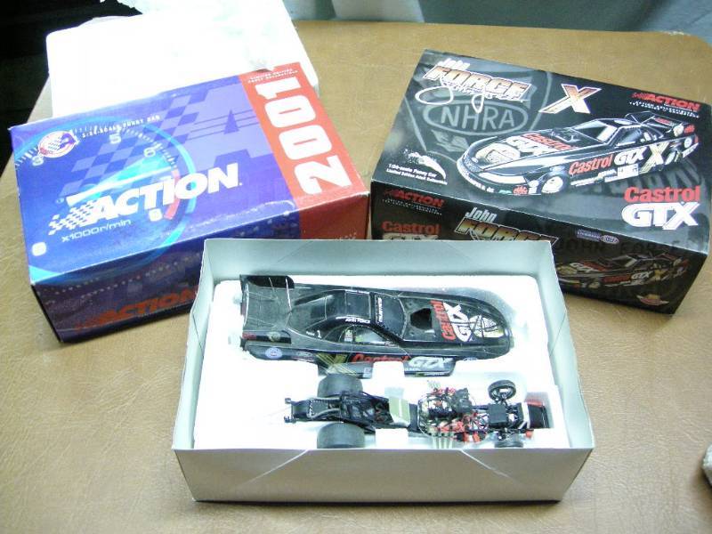 lot 72 image: Signed John Force Action Die Cast Car
