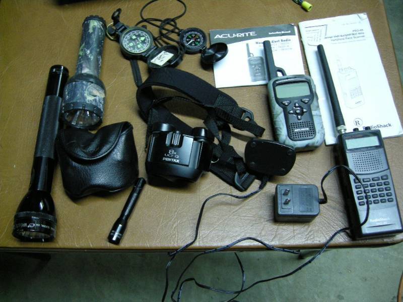 lot 87 image: Weather Radio, Scanner, Flashlights, Compasses, Binocs
