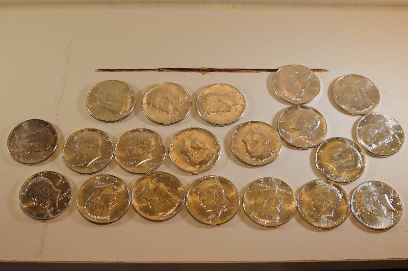 Tube of Kennedy half Dollars