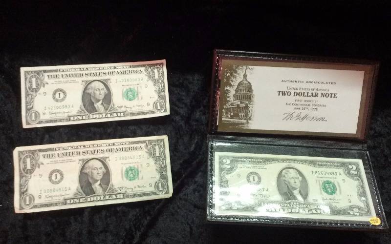 Lot - 2003 $2 Uncirculated Note, x2 1963A $1 Notes, $1 Wyoming Comm Sticker