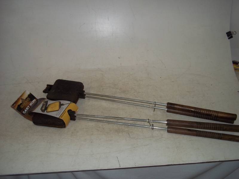 lot 98 image: Pair of Cast iron camp Cookers