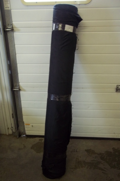lot 174 image: Large roll of black coat liner 55  Wide