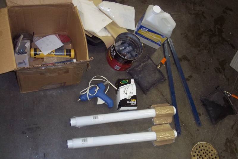 lot 230 image: Glue gun, 2 table legs, spring clamps, mineral spirits
