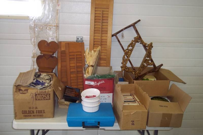 lot 313 image: Lots of dishware, lots of dcor, magnetic recording tapes, candy dishes, plates, plate holder, spoon racks