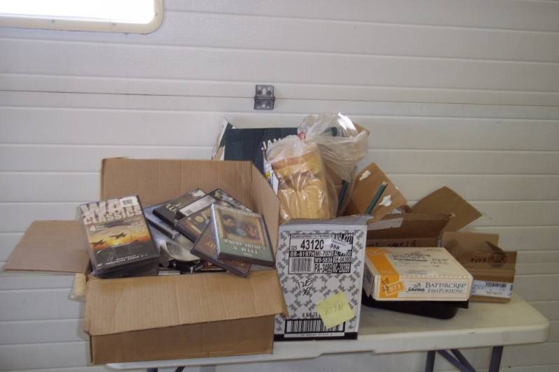 lot 315 image: Magnetic trays, wood craft pieces, salt shakers, assorted war movies, foam, magnetic recording tapes