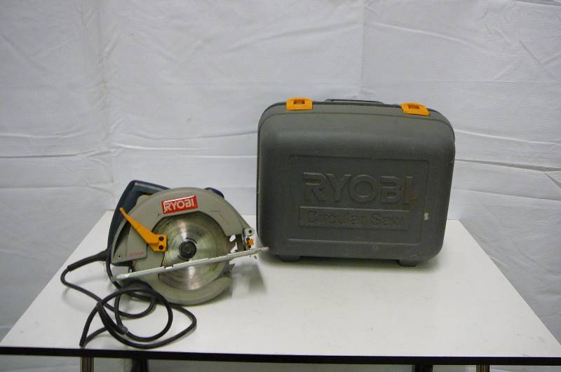 lot 13 image: RYOBI 7 14 Circular saw with case works