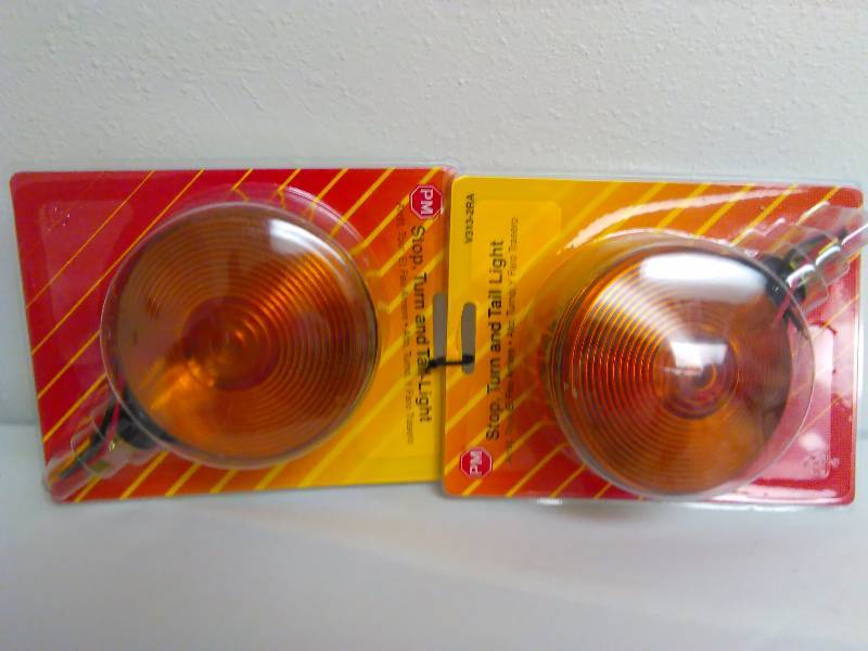 lot 31 image: Stop Turn Tail Lights (2), Red and Amber, by Peterson