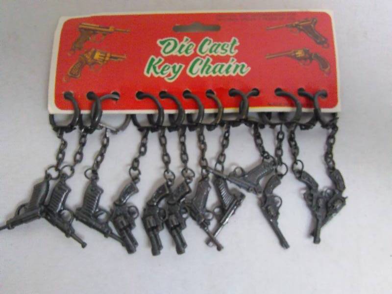 lot 408 image: Vintage Die Cast Pistol Key Chains (12)