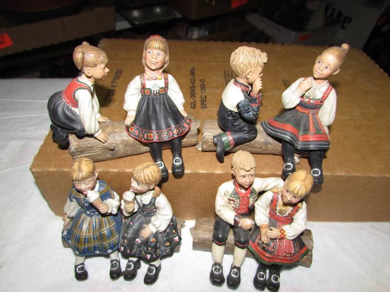 lot 43 image: Boy and Girl Figurines