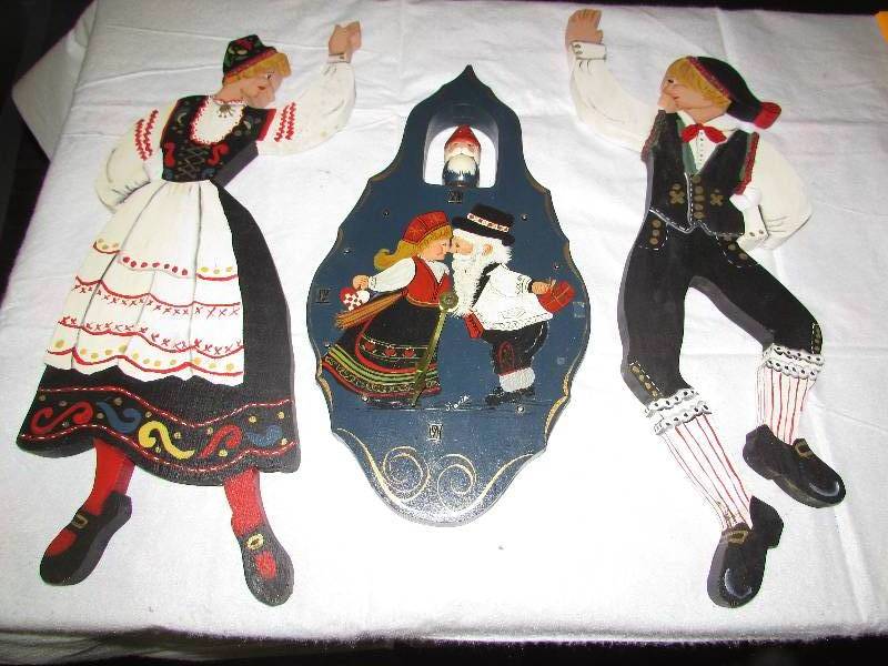 lot 49 image: Wooden dcor, painted, wood cutout of Norwegian dancers and clock