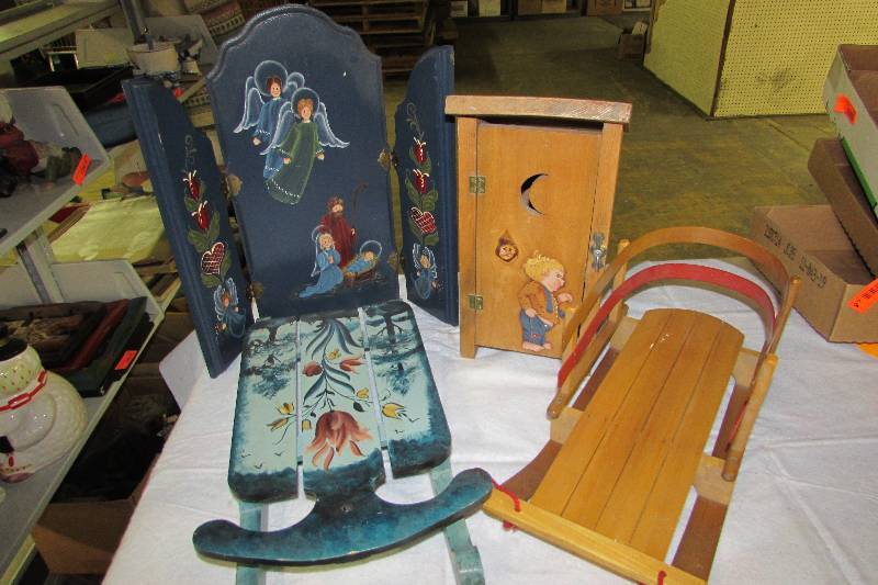 lot 61 image: Rosemal Painted Wooden wall dcor, small doll sled, and outhouse TP holder