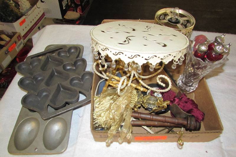 lot 96 image: Household Dcor items, metal heart and egg molds, pedestal platter, fringe, butter knives and more