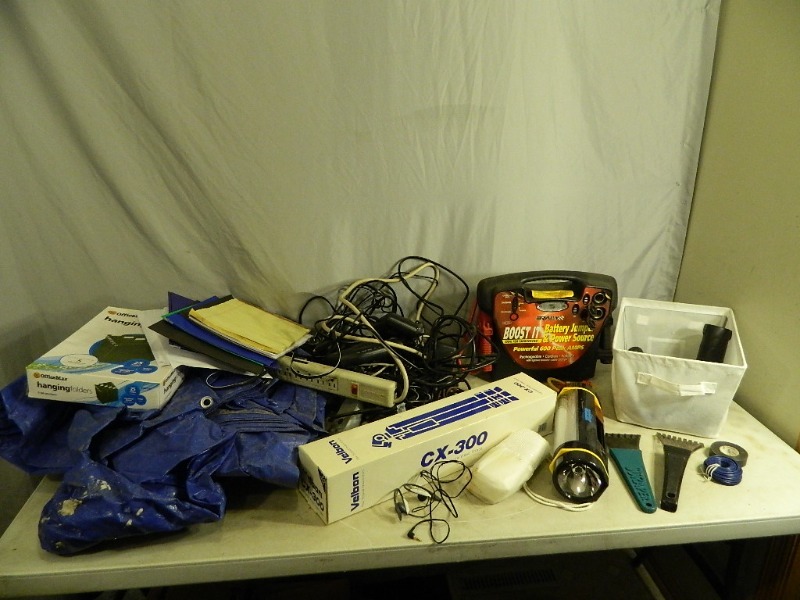 lot 84 image: Tarp, Battery Jumper, and More
