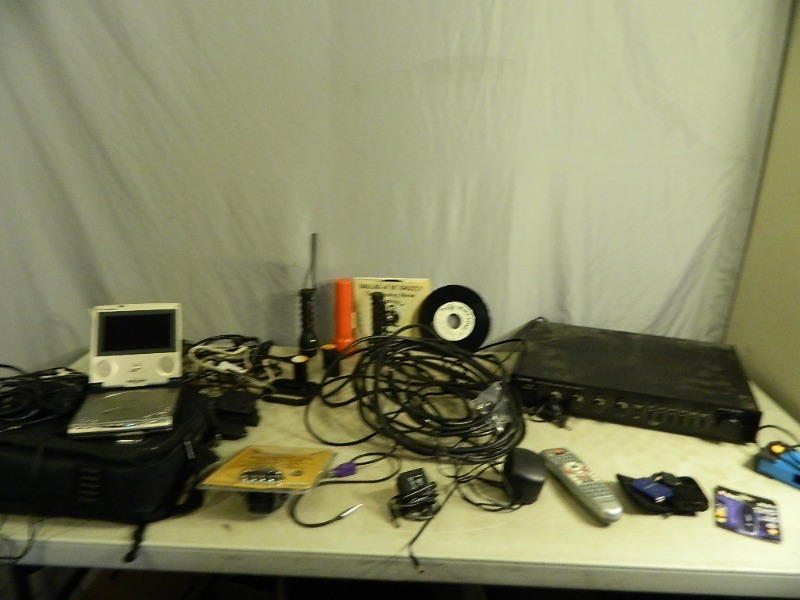 lot 105 image: Portable DVD Player, New Flash Drive, and Assorted Electronics
