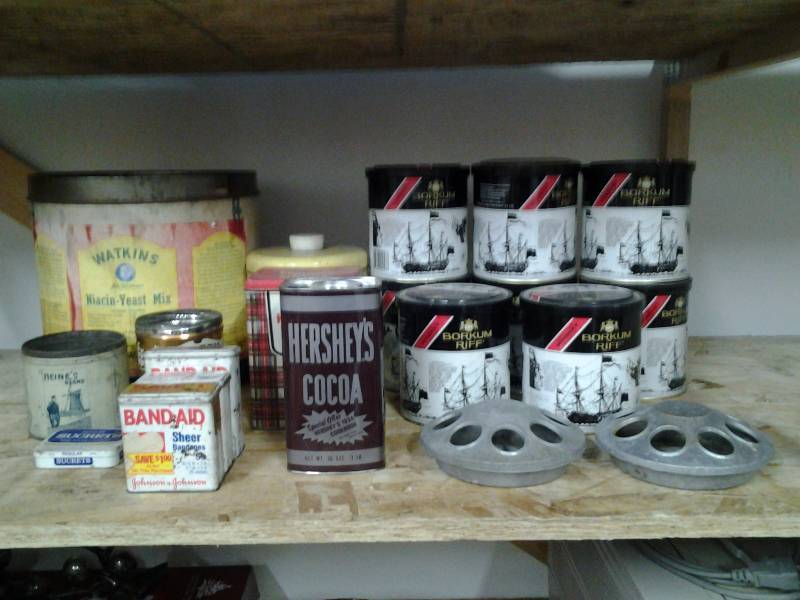 lot 38 image: 2-Old Chicken Feeders, Box Of Antique Tins-Watkins, Band-Aid, Tobacco