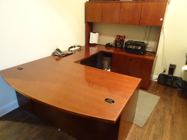 lot 15 image: U shaped office desk. 3 drawers. 2 lateral drawers. 4 doors on hutch. Includes keys. 4 pieces. 107 x 72 x 71.