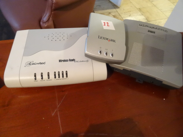 lot 22 image: Cisco wireless access point. Air-AP1231G-A-K9. Lexmark wireless printer hub. N4000E. Action tech wireless readyDSL gateway. R1520SU