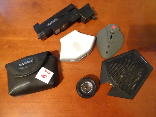 lot 24 image: 100 times zoom panasonic. FF394 micro fiber light scope. Bushnell mini binochular. Belkin flip USB F10F102U. Polycom sound station. 2201-02138-001. Audio technical AT871R microphone. Tominon camera lens. 145 F50MM.