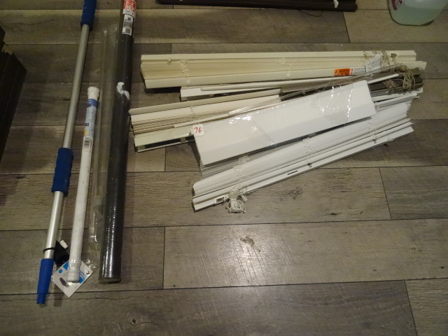 lot 76 image: Misc window blinds. New roll of screen. Shower curtain rod, and more