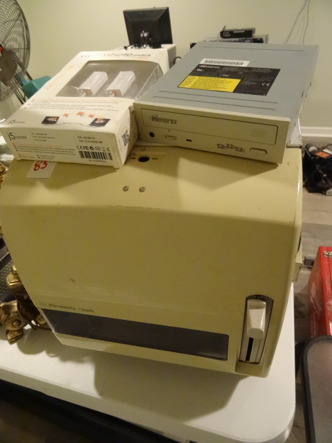 lot 85 image: Table lamp. Roll towel dispenser. Worm hole switch. Memorex CD-RW drive