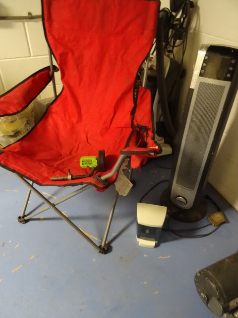 lot 89 image: Fold up camping chair. Lasko moveable air heater. Wall mount hand soap dispenser. Rolling measurer