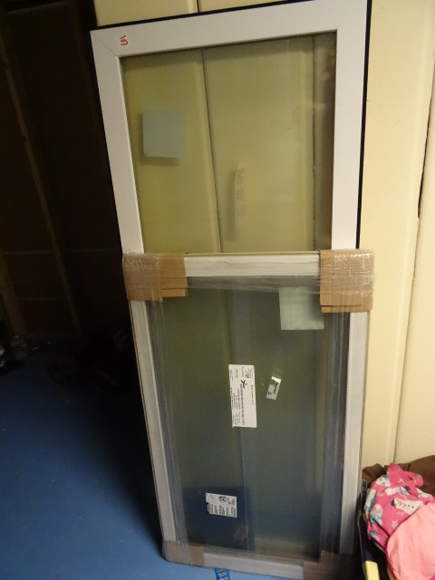 lot 107 image: 2 window sashes. 23 x 58. 22 x 39