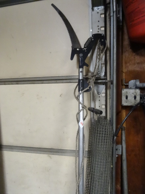 lot 102 image: Roll of wire mesh. Tree pole pruner