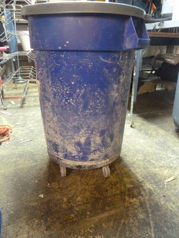 lot 63 image: Rubbermaid Recycle Trash Bin on Caster Base
