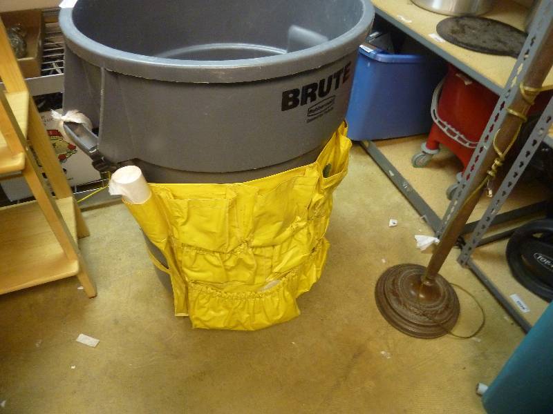 lot 129 image: Rubbermaid Brute Trash Can On Caster Base and with Can Caddy