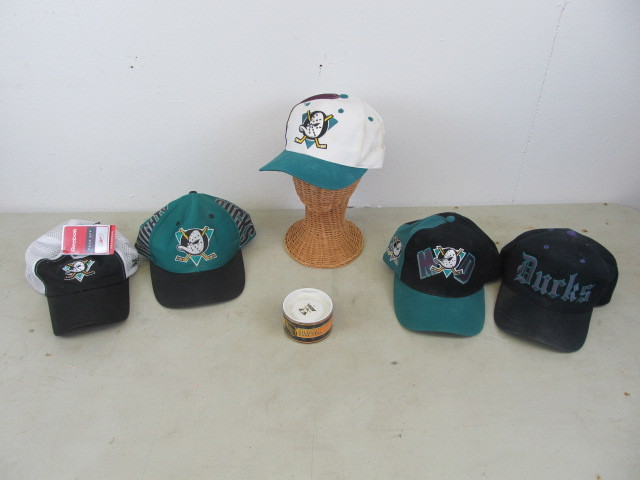 lot 12 image: Anaheim Mighty Ducks Hats & Puck