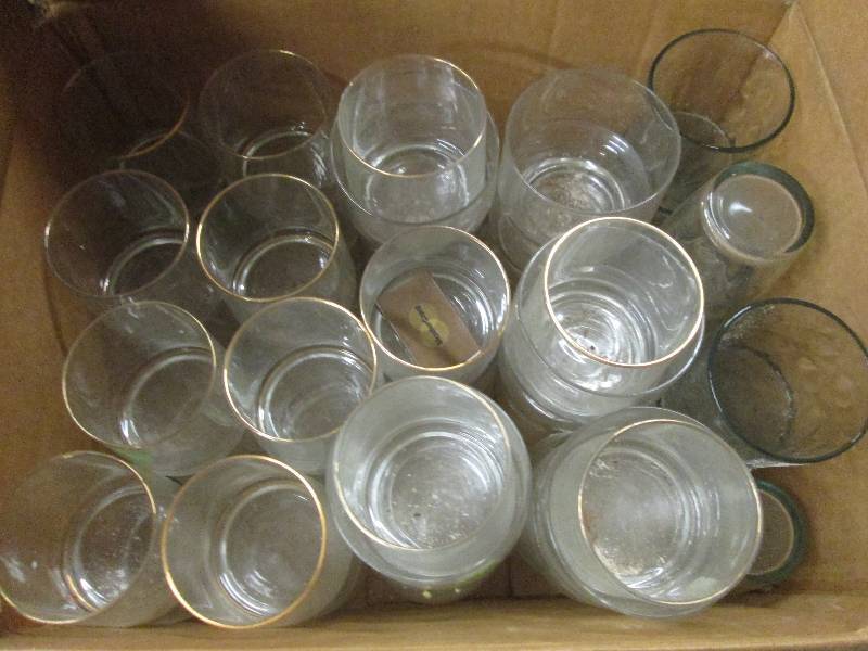 lot of drinking glasses , fake flow...