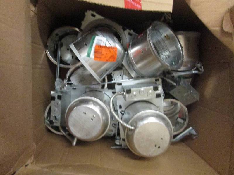 box full of recessed lighting cans...